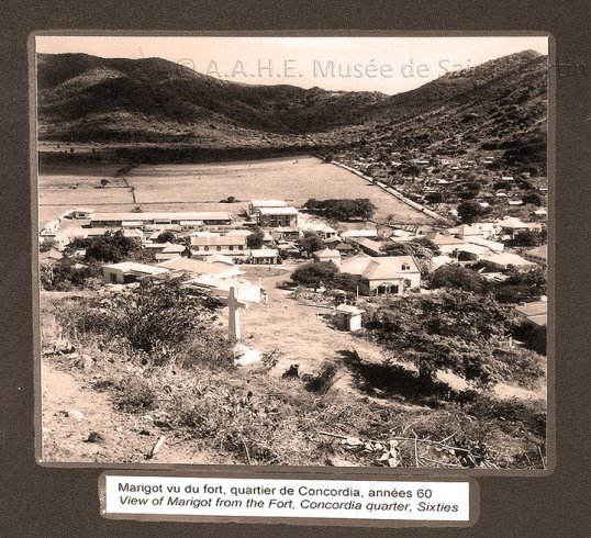 Old photo of the town of Marigot showing the R.C. Church in former times. 